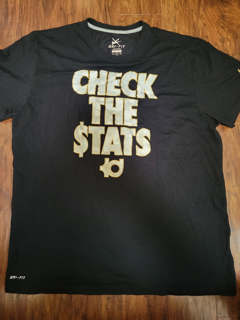 Nike Black Short Sleeve Tee with Gold 'Check The $tats' Graphic